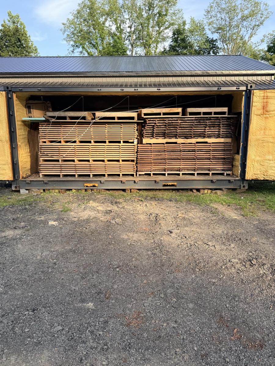 A full kiln load of stickered lumber inside the iDRY AIR container kiln