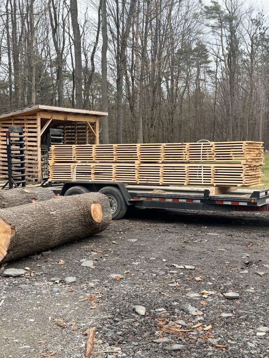 A trailer load of sawn softwood lumber heading out of the yard